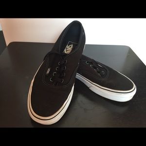 Vans with multicolored shoelace holes